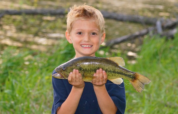 Kid Holding a Bass